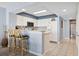 Kitchen view with white appliances and breakfast bar at 1003 S Ocean Blvd. # 802, North Myrtle Beach, SC 29582