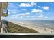 View from the balcony showing the beach and the ocean at 1003 S Ocean Blvd. # 802, North Myrtle Beach, SC 29582