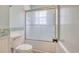 The bathroom features a toilet, and a shower with glass doors at 1024 Palmetto St., Georgetown, SC 29440