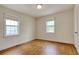 Bedroom with wood floors, natural light from two windows, and neutral walls at 1024 Palmetto St., Georgetown, SC 29440
