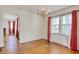 Bright dining area with hardwood floors, large window and chandelier at 1024 Palmetto St., Georgetown, SC 29440