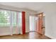 Bright entryway featuring a wood floor, large window and an orange front door at 1024 Palmetto St., Georgetown, SC 29440