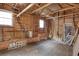 Unfinished garage space with exposed beams, wood walls, concrete floors and natural light at 1024 Palmetto St., Georgetown, SC 29440