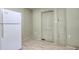 This is a kitchen with a white refrigerator and a door to the exterior at 1024 Palmetto St., Georgetown, SC 29440