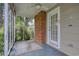 Screened porch features brick accent and access to the backyard at 1024 Palmetto St., Georgetown, SC 29440