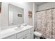 Bathroom features a single sink vanity, large mirror, and shower with curtain at 1074 Sennema Circle, Myrtle Beach, SC 29588