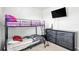 A bedroom featuring bunkbeds, dark wood dresser, and mounted TV at 1074 Sennema Circle, Myrtle Beach, SC 29588