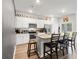 Kitchen with white cabinets, stainless steel appliances, granite countertops, and a kitchen island at 1074 Sennema Circle, Myrtle Beach, SC 29588