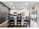 Kitchen with white cabinets, stainless steel appliances, granite countertops, and an island with bar stool seating at 1074 Sennema Circle, Myrtle Beach, SC 29588