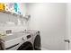 Well-equipped laundry room featuring modern appliances and ample shelving for storage and organization at 1074 Sennema Circle, Myrtle Beach, SC 29588