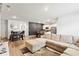 Bright living room features wood floors and a large sectional sofa at 1074 Sennema Circle, Myrtle Beach, SC 29588