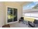 Covered patio with cozy furniture, perfect for relaxing and entertaining while enjoying the outdoors at 1074 Sennema Circle, Myrtle Beach, SC 29588
