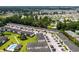 Community aerial view featuring lush landscaping, a pool, and ample parking for convenient living at 1101 2Nd Ave. N # 1501, Surfside Beach, SC 29575