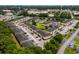 Residential community showcasing lush surroundings, a sparkling pool, and convenient parking areas for residents at 1101 2Nd Ave. N # 1501, Surfside Beach, SC 29575