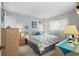 Comfortable bedroom with neutral walls, patterned bedding, and a large window at 1101 2Nd Ave. N # 1501, Surfside Beach, SC 29575