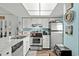Bright kitchen with stainless steel appliances, white cabinets, and a large undermount sink at 1101 2Nd Ave. N # 1501, Surfside Beach, SC 29575