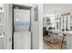 Convenient laundry area featuring a stacked washer and dryer unit near living area at 1101 2Nd Ave. N # 1501, Surfside Beach, SC 29575