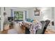 Relaxing living area features a sliding glass door to the outdoor patio and comfortable furnishings at 1101 2Nd Ave. N # 1501, Surfside Beach, SC 29575