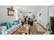 Cozy living room with nautical decor, wood floors, and comfortable seating offers a welcoming atmosphere at 1101 2Nd Ave. N # 1501, Surfside Beach, SC 29575