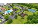 Aerial view of the community amenities including the pool, clubhouse, and tennis courts at 1106 Bluffton Ct., Myrtle Beach, SC 29579