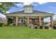 Covered back porch with brick columns overlooking the lawn and backyard at 1106 Bluffton Ct., Myrtle Beach, SC 29579