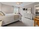Bright bedroom with soft neutral colors, carpet, and a window with patterned curtains at 1106 Bluffton Ct., Myrtle Beach, SC 29579