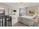 Well-lit bedroom featuring neutral walls, patterned curtains, and a view to the outside at 1106 Bluffton Ct., Myrtle Beach, SC 29579