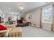 Spacious bonus room with comfortable seating, natural light, and carpeted floor at 1106 Bluffton Ct., Myrtle Beach, SC 29579