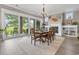 Bright dining room with a fireplace, built-in shelving, and a view of the outdoor patio at 1106 Bluffton Ct., Myrtle Beach, SC 29579