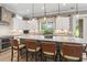 Gourmet kitchen featuring granite countertops, a mosaic backsplash, and an island with bar seating at 1106 Bluffton Ct., Myrtle Beach, SC 29579