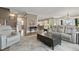 Open concept living room with hardwood floors, comfortable seating, and ample natural light at 1106 Bluffton Ct., Myrtle Beach, SC 29579