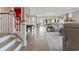 Open-concept living room flowing into the dining area, with stairs to the upper level at 1106 Bluffton Ct., Myrtle Beach, SC 29579