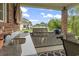 Covered patio area with a stainless steel built-in grill, sink and a beautiful backyard view at 1106 Bluffton Ct., Myrtle Beach, SC 29579