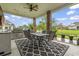 Outdoor patio has a built-in grill and scenic view of the pond and landscaped backyard at 1106 Bluffton Ct., Myrtle Beach, SC 29579
