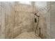 Tiled walk-in shower featuring a built-in seat, mosaic accents, and a handheld shower head fixture at 1106 Bluffton Ct., Myrtle Beach, SC 29579