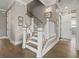 Classic staircase featuring white spindles and wood treads, leading to the upper level at 1106 Bluffton Ct., Myrtle Beach, SC 29579