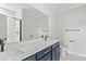 Bathroom with a double sink vanity, large mirror, and modern finishes at 1201 Crooked Hook Rd., North Myrtle Beach, SC 29582