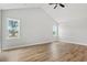 Spacious bedroom featuring wood-look flooring and bright windows offering great light at 1201 Crooked Hook Rd., North Myrtle Beach, SC 29582