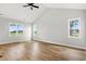 Spacious room with wood-look flooring, cathedral ceiling, and bright windows offering great light at 1201 Crooked Hook Rd., North Myrtle Beach, SC 29582