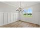 Inviting dining room with wood floors and a large window overlooking the backyard at 1201 Crooked Hook Rd., North Myrtle Beach, SC 29582