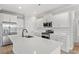Modern kitchen featuring stainless steel appliances, white cabinets, and a quartz countertop at 1201 Crooked Hook Rd., North Myrtle Beach, SC 29582