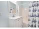 A well lit bathroom featuring a bathtub, shower, and a mirror over the vanity at 121B 7Th Ave. S, Surfside Beach, SC 29575