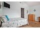 A well lit and decorated bedroom with a TV, bed, and beach themed decorations at 121B 7Th Ave. S, Surfside Beach, SC 29575