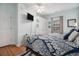 Comfortable bedroom with a TV, closet, and serene beach-themed decorations at 121B 7Th Ave. S, Surfside Beach, SC 29575