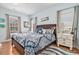 Cozy bedroom with a plush bed, soft lighting, and hardwood flooring at 121B 7Th Ave. S, Surfside Beach, SC 29575