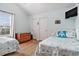 Inviting bedroom with twin beds, a wooden dresser, and beach themed decorations at 121B 7Th Ave. S, Surfside Beach, SC 29575