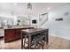 Open-concept kitchen with granite countertops, dark wood cabinets, and bar seating at 121B 7Th Ave. S, Surfside Beach, SC 29575