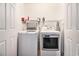 A laundry room featuring a washer and dryer with shelving and storage at 121B 7Th Ave. S, Surfside Beach, SC 29575