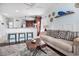Bright living space with coastal decor, comfortable sofa, and seamless flow to the kitchen at 121B 7Th Ave. S, Surfside Beach, SC 29575