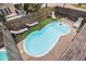Aerial view of a backyard pool and outdoor seating area surrounded by a wooden fence at 121B 7Th Ave. S, Surfside Beach, SC 29575